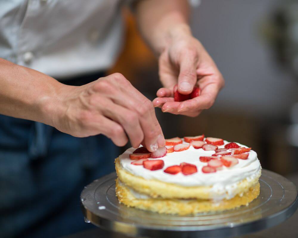 man making a strawberry cake